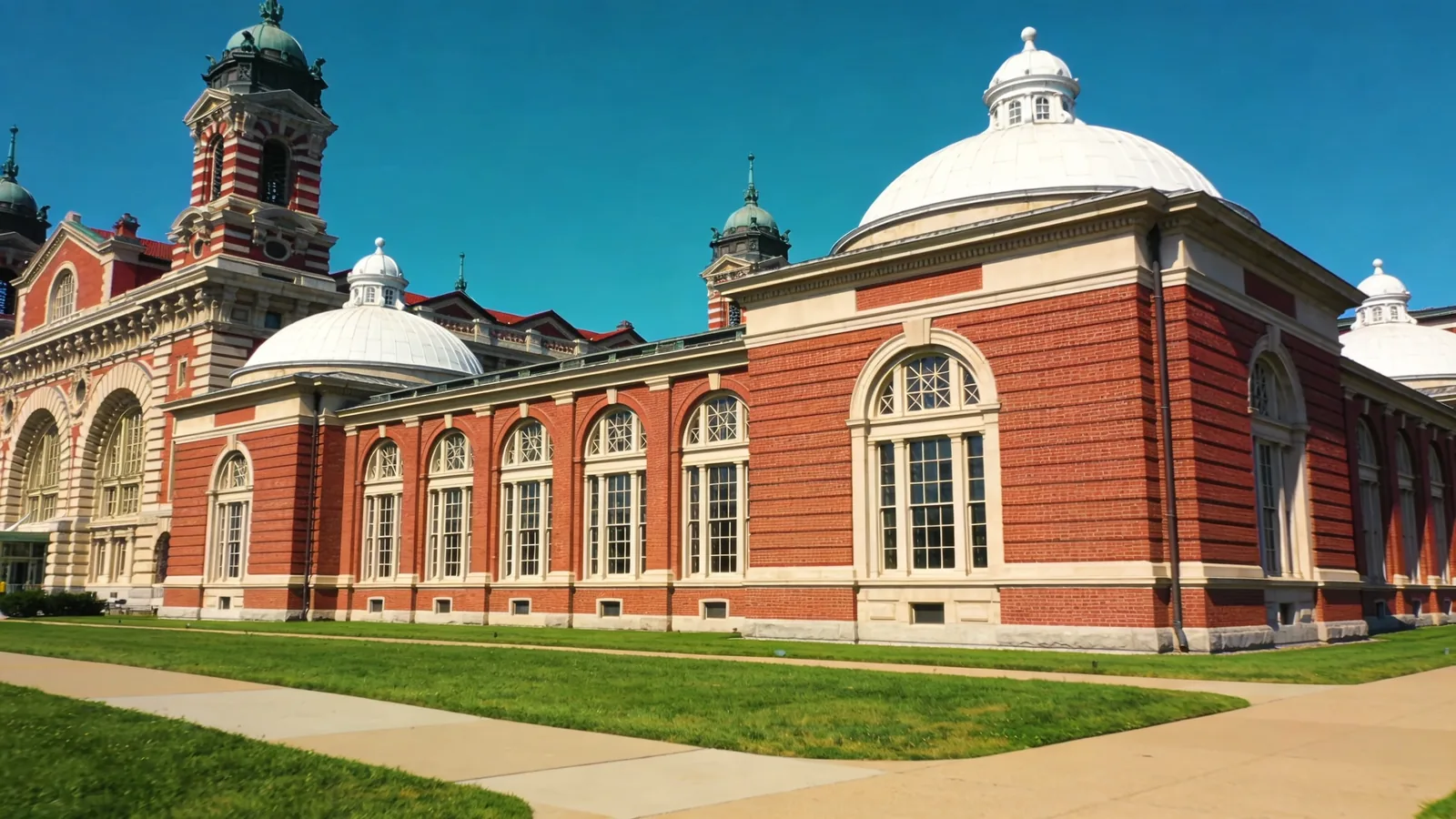 Ellis Island main building exterior in summer — Statue of Liberty cruise in summer afternoon AC stop