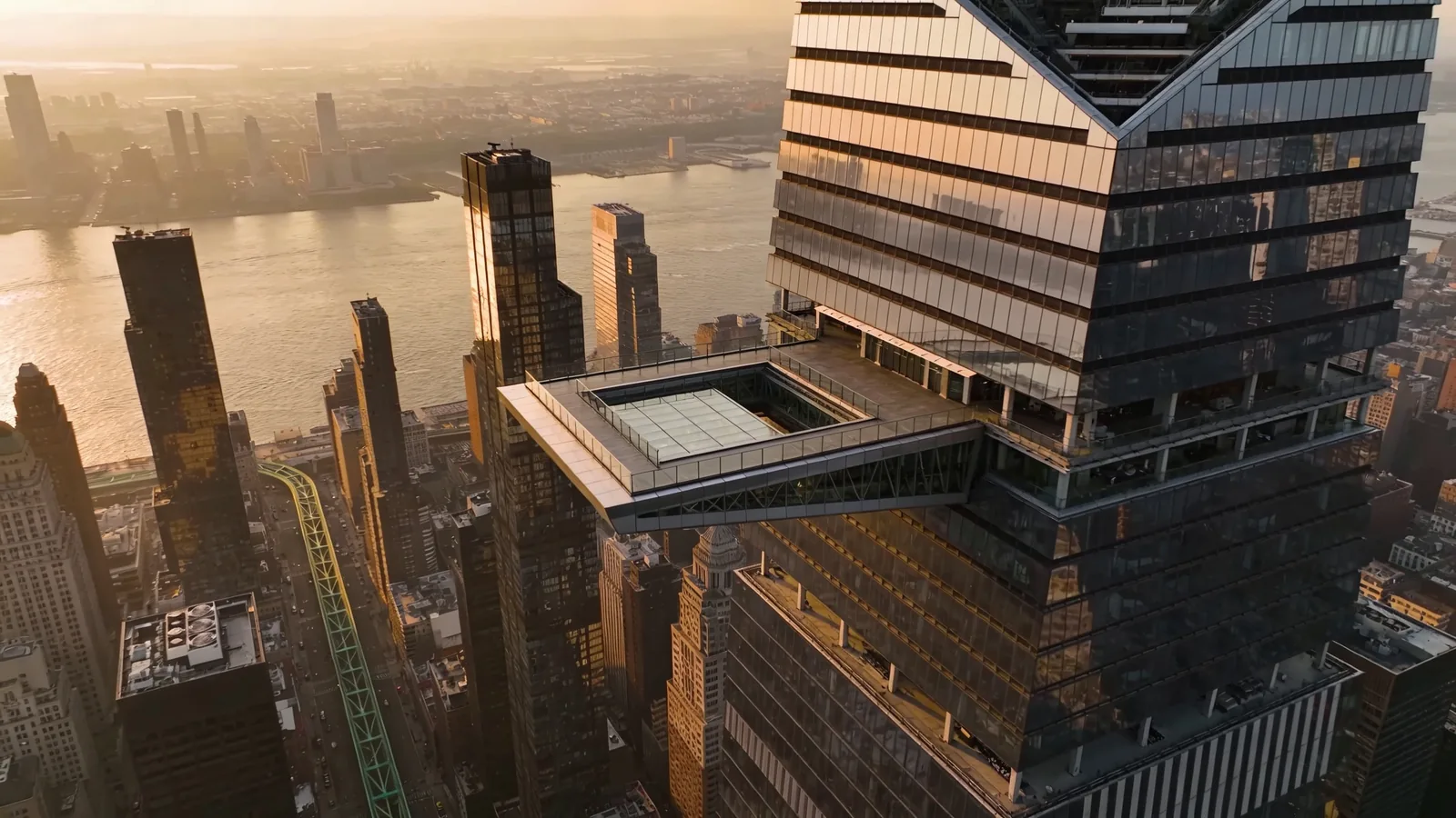 Aerial view of Hudson Yards with The Edge protruding from 30 Hudson Yards tower — The Edge vs Top of the Rock Hudson side