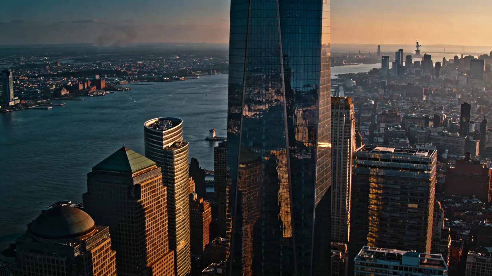 Aerial view of Lower Manhattan financial district with harbor — Empire State vs One World Observatory downtown perspective
