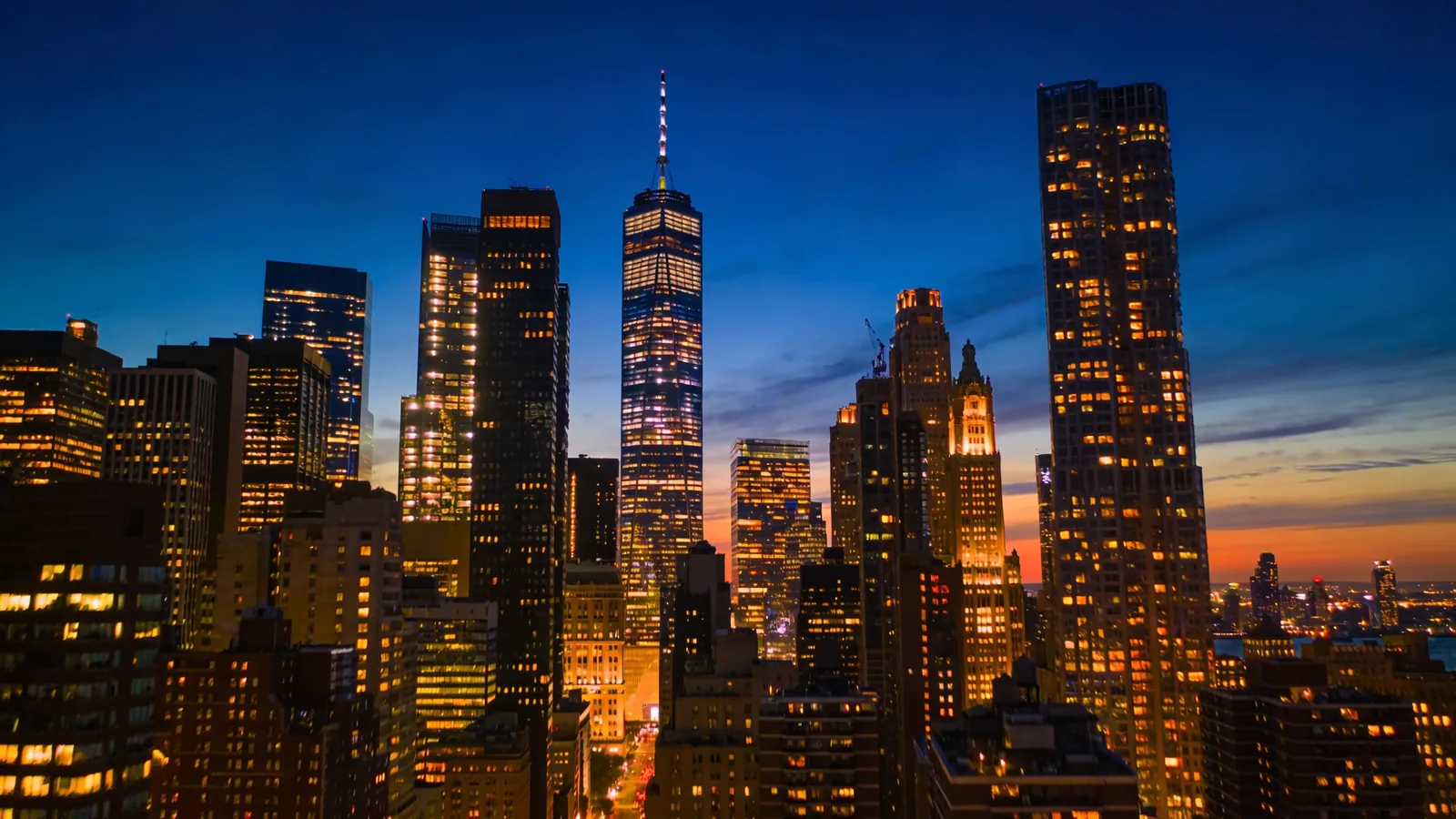 Manhattan skyline at blue hour with city lights and cobalt sky — Empire State sunset tickets blue hour photography